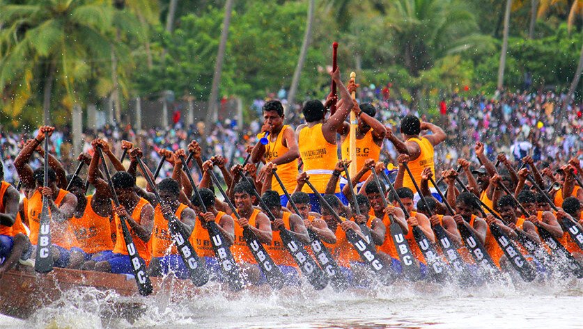 Beautifully decorated traditional Palliyodam snake boat racing on the River Pamba during the Aranmula Boat Race