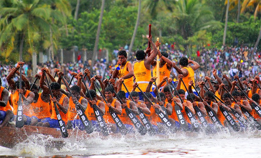 Beautifully decorated traditional Palliyodam snake boat racing on the River Pamba during the Aranmula Boat Race